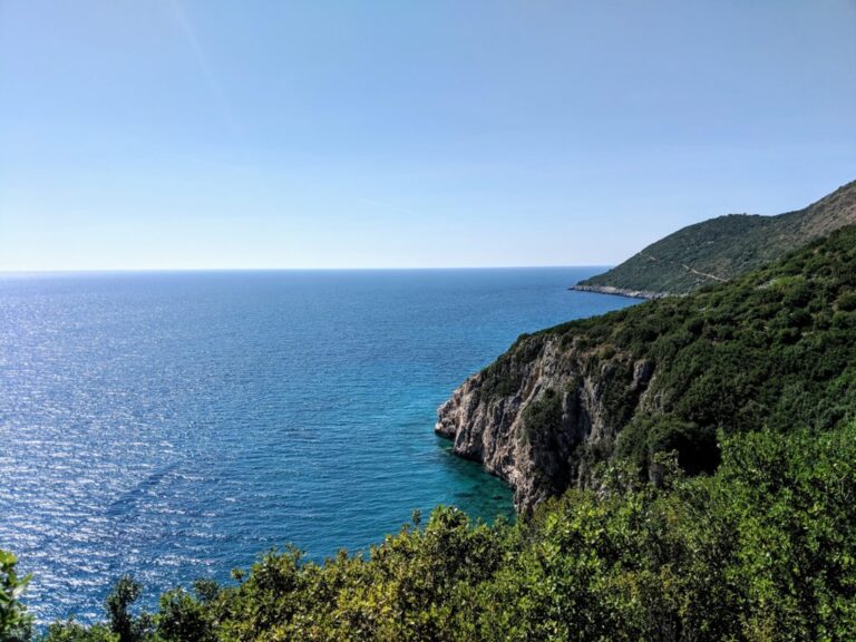 Rocky green coastline above the blue Ionian Sea along the trail from Gjipe to Jala beach